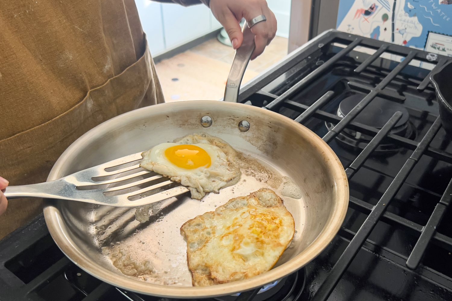A person flips eggs cooking in the Made In Small Spaces 3 Piece Cookware Set pan