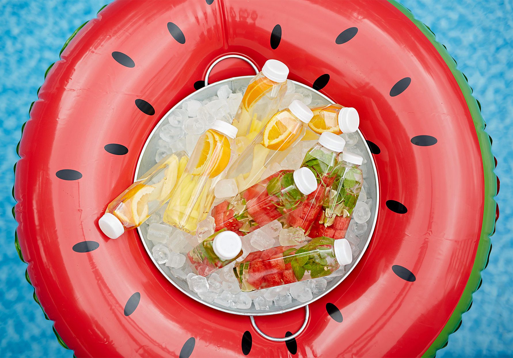 watermelon inner tube with fruit-infused bottles