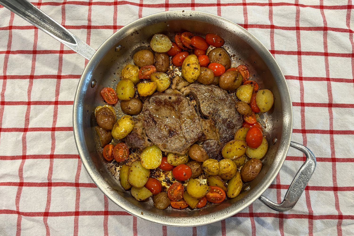 Meat and vegetables cooked in the All-Clad D3 3-Ply Stainless Steel Cookware Set pan