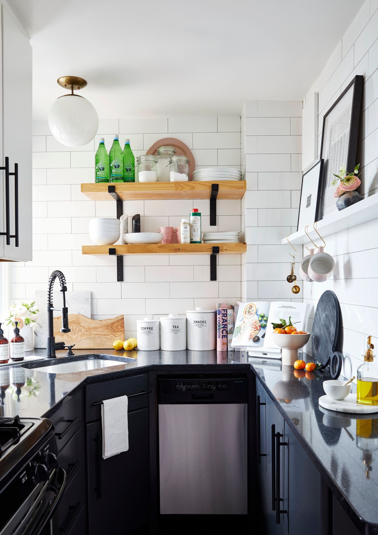 small black and white kitchen with open shelves