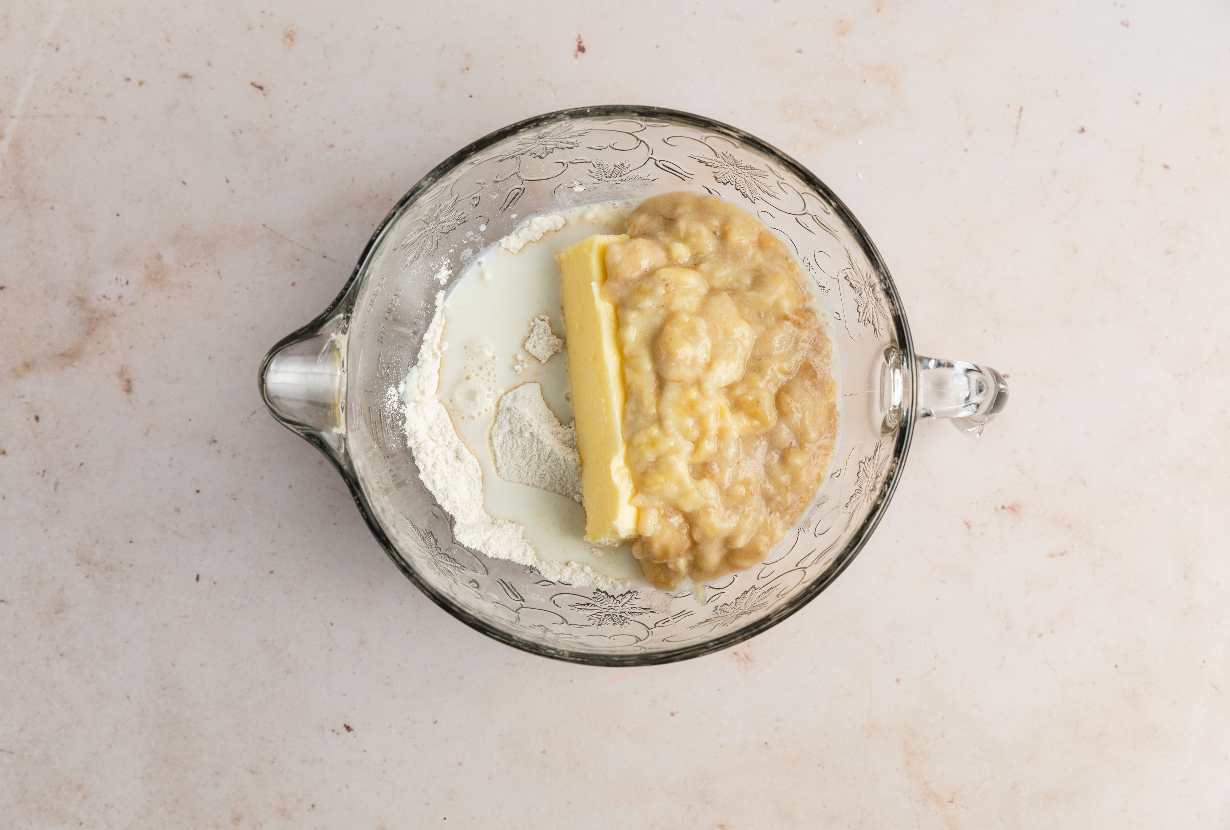 add mashed banana and butter