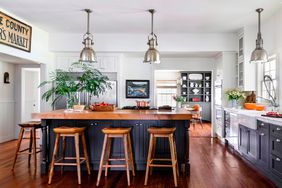 Farmhouse kitchen with navy cabinets and natural wood tones