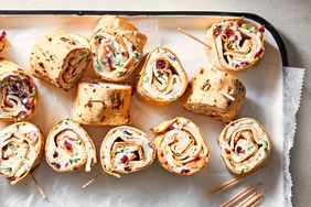 Turkey cranberry rollups arranged on a tray garnished lightly and presented without additional decoration