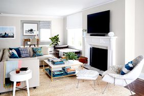 Living room with rug, fireplace, and coffee table