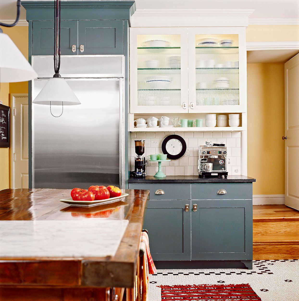 blue cabinets with coffee station shelf