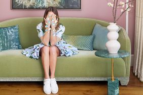 Wishbone Kitchen's Meredith Hayden on green sofa covering eyes