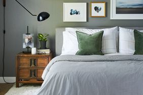 bedroom with collection of artwork