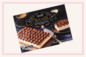 Storebought tiramisu in its packaging displayed against a neutral background prominently branded with decorative lettering
