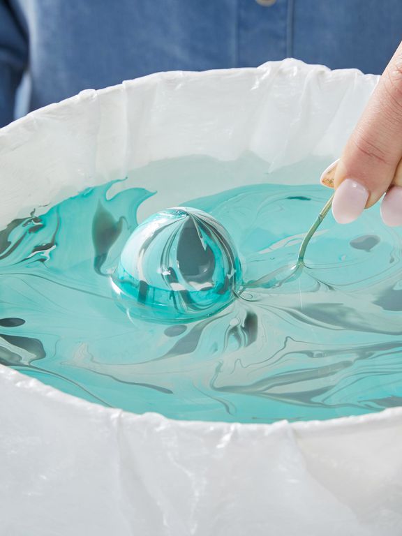 dipping egg into nail polish swirled dye