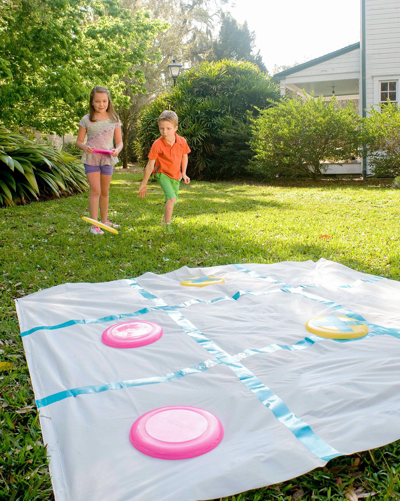 kids playing disc tic-tac-toe outdoors