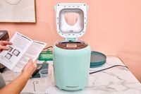 The Elite Gourmet Programmable Bread Maker with the top open