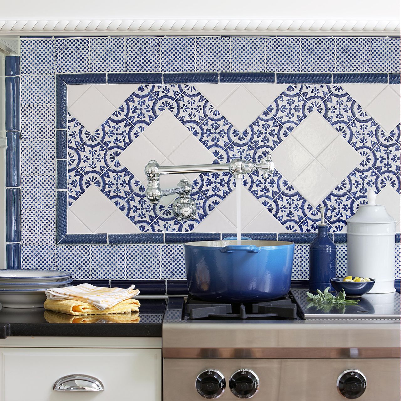 blue and white european range backsplash