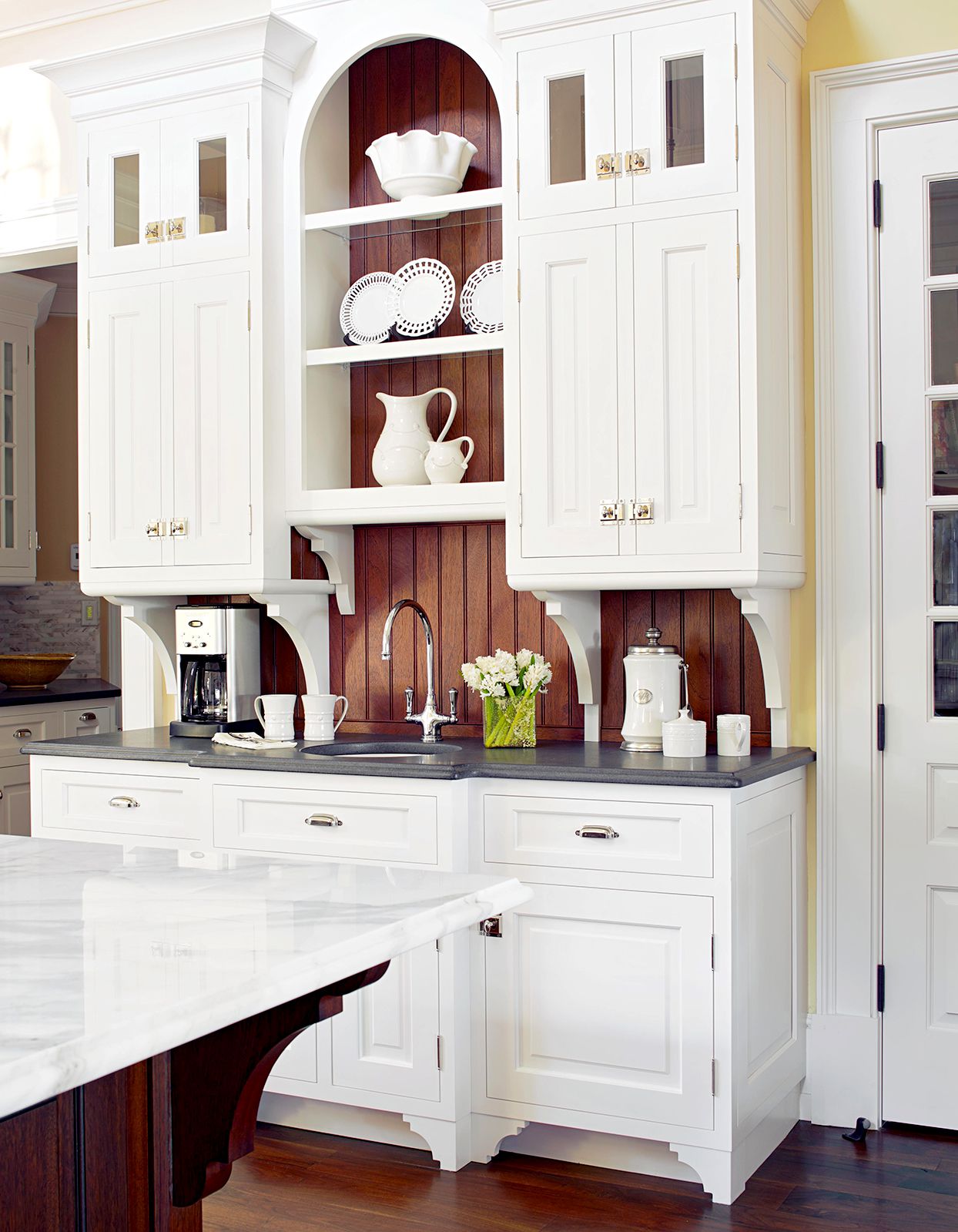 Kitchen with white painted cabinetry
