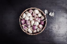 Fresh purple garlic in basket