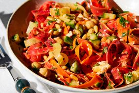 Bowl of carrot ribbon salad with chickpeas and cucumber