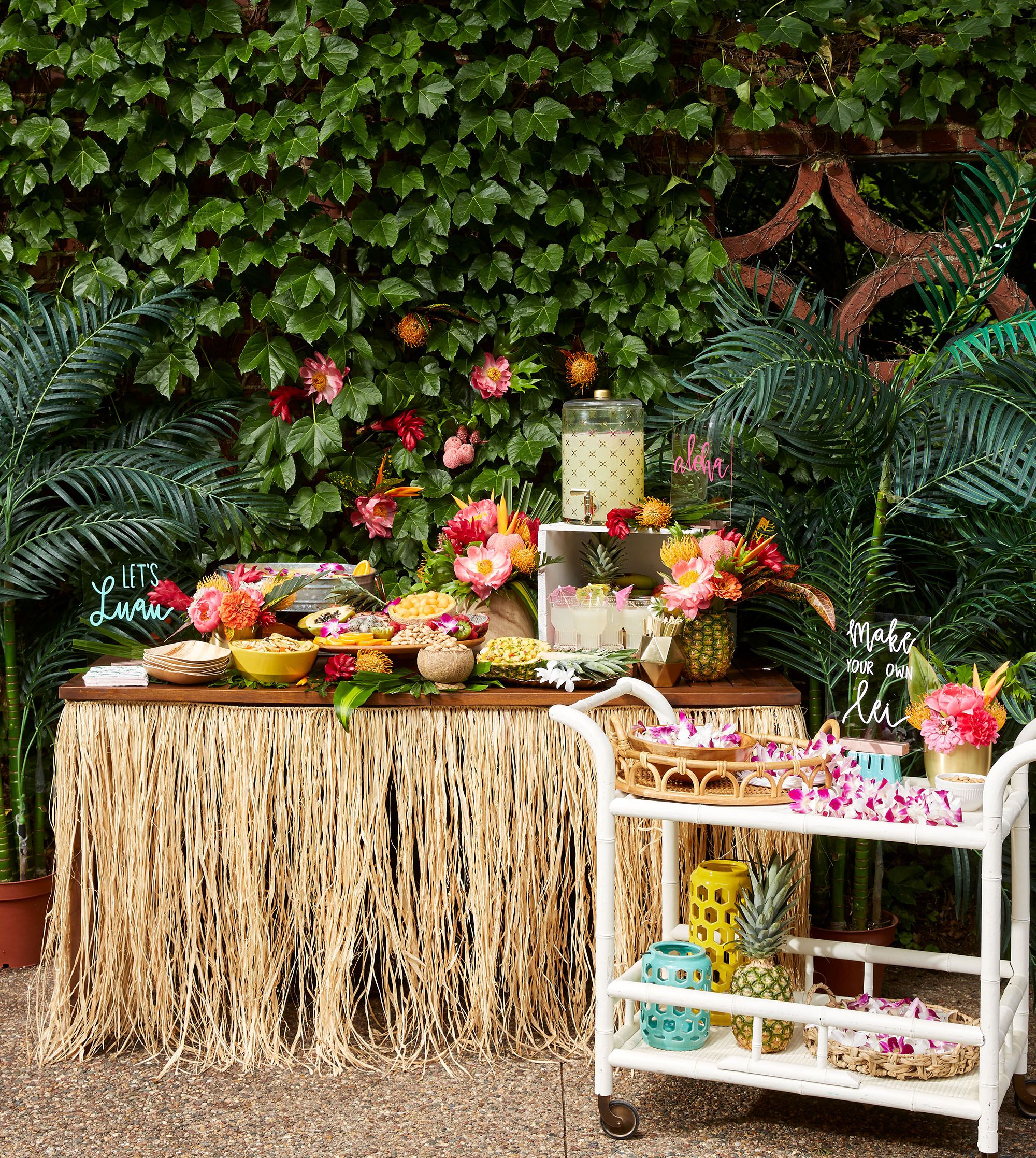 food table with grass skirt white cart