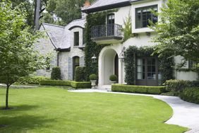 lawn with house and hedge