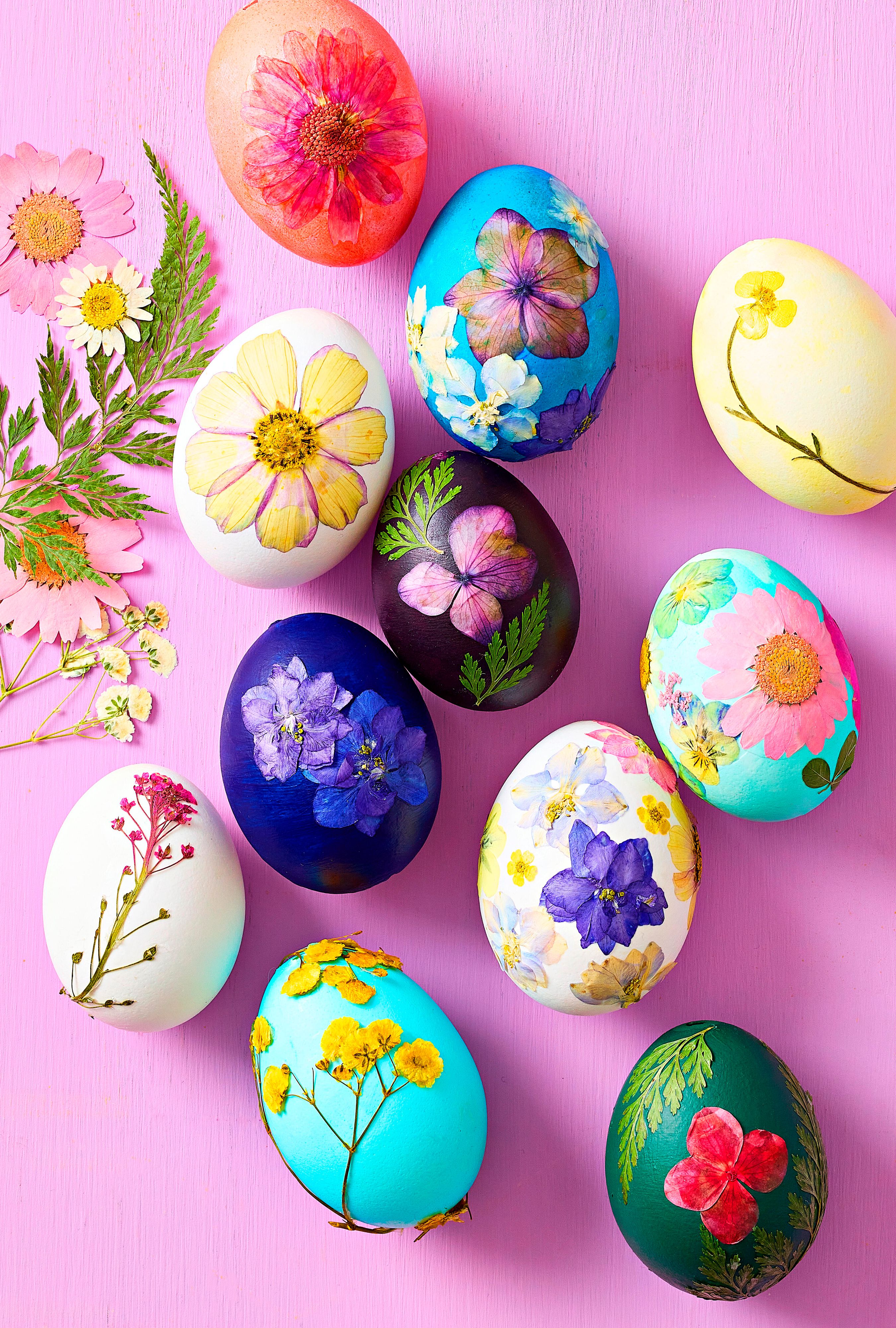 Collection of botanical eggs crafted with dried, pressed flowers