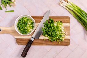 chopped green onions on a cutting board