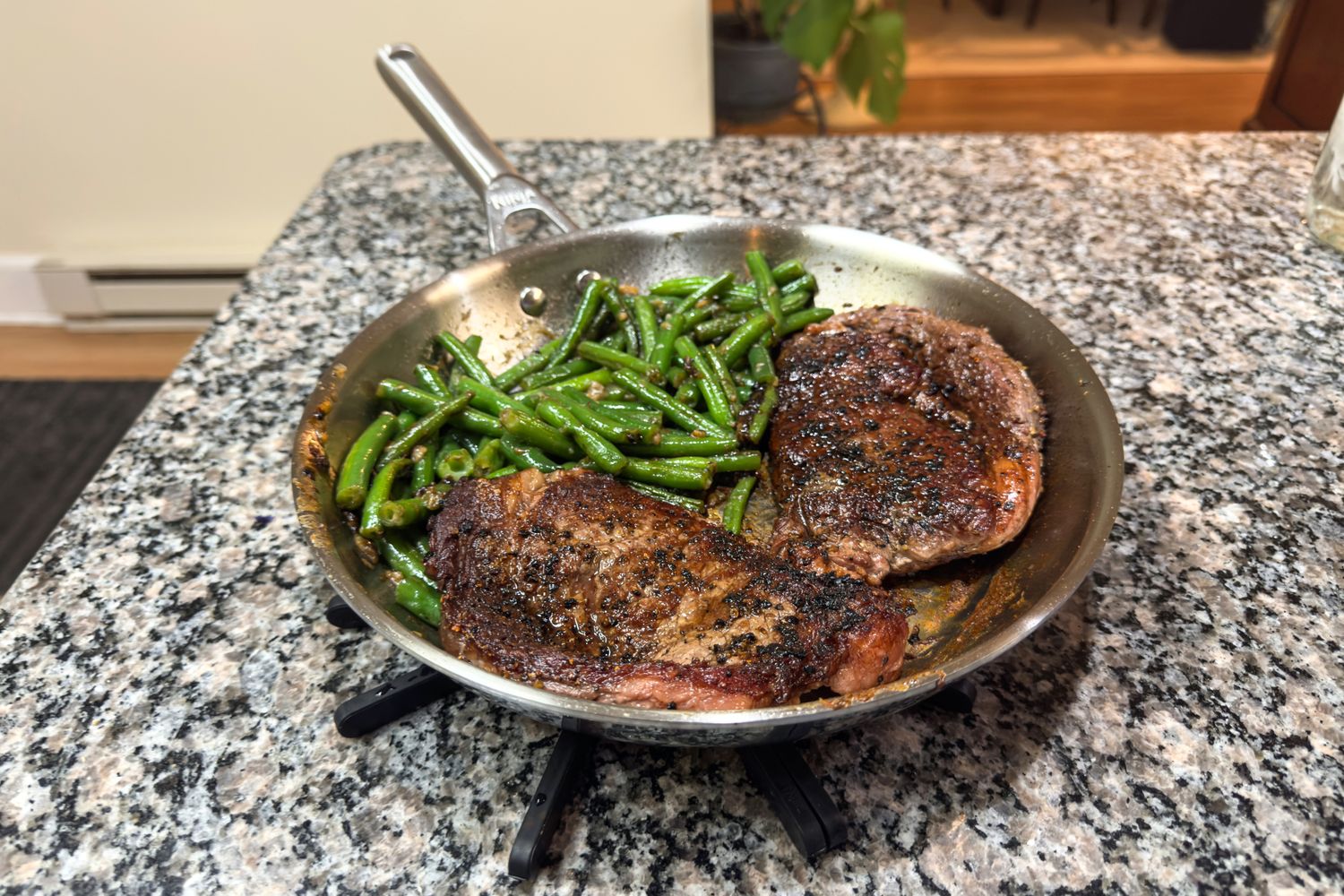 Meat and green beans cooked in the Ninja EverClad Stainless Steel Cookware Pots and Pans Set pan